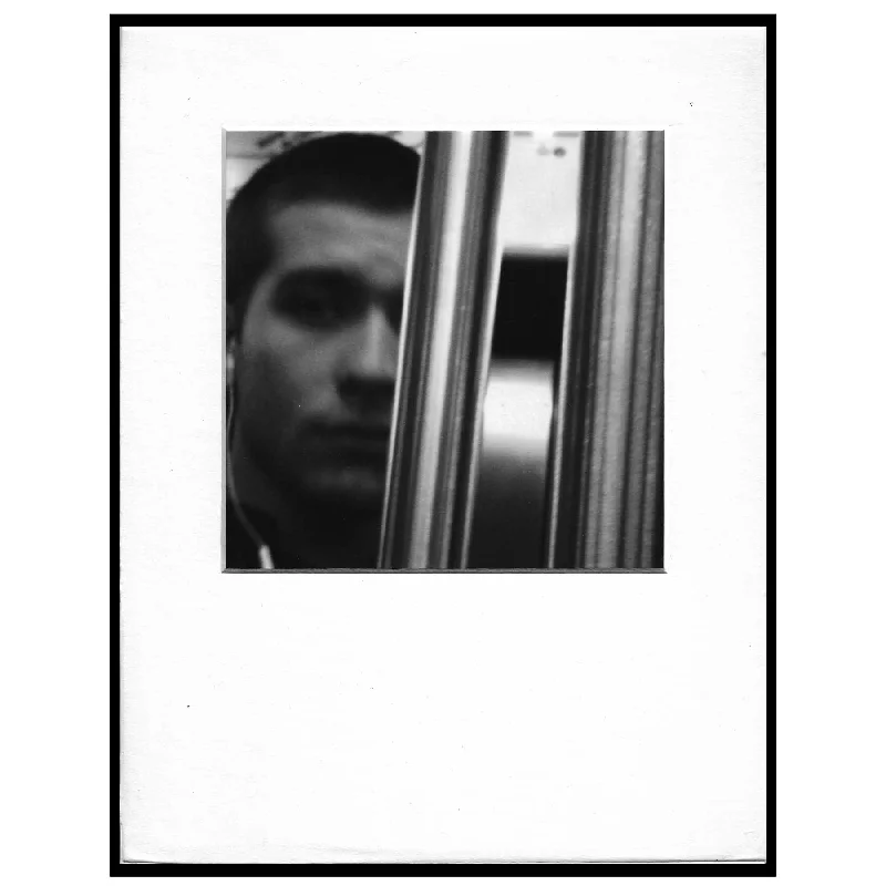 Untitled (pole obscuring face)